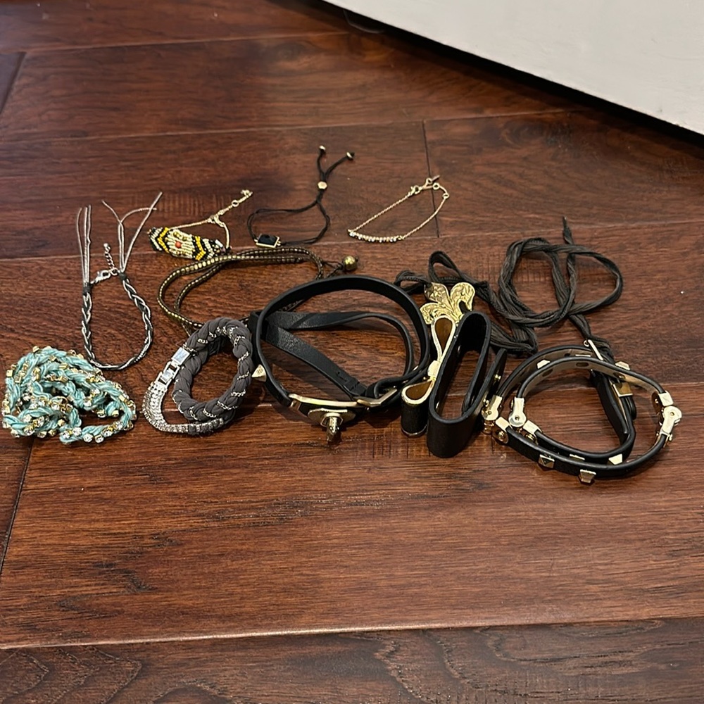 Bundle of wrap bracelets in black, gold, silver and blue color